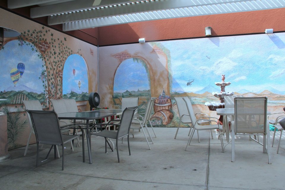 Dining room with tables beside airport windows.